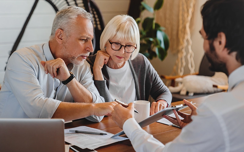 older couple meeting with a banker