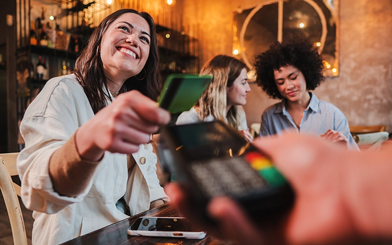 woman paying with credit card